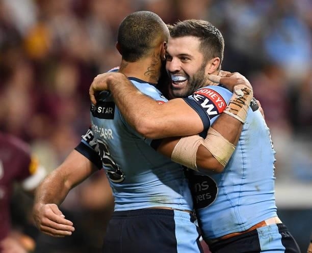 James Tedesco and Josh Addo-Carr of the Blues celebrate the try of Tom Trbojevic of the Blues during game one of the 2021 State of Origin series...