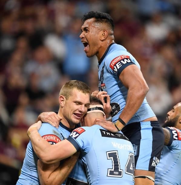 Tom Trbojevic of the Blues celebrates after scoring a try during game one of the 2021 State of Origin series between the New South Wales Blues and...