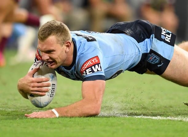 Tom Trbojevic of the Blues scores a try during game one of the 2021 State of Origin series between the New South Wales Blues and the Queensland...
