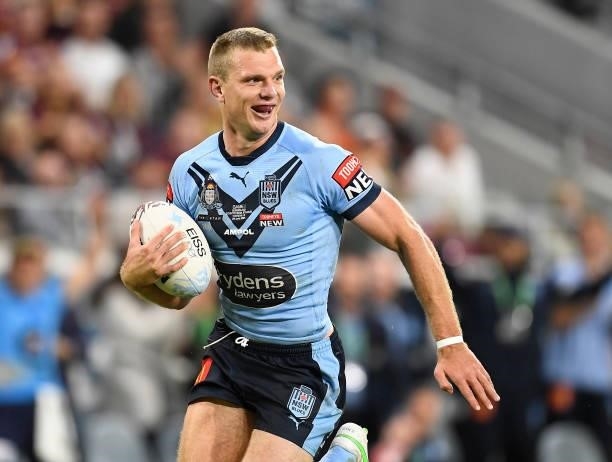Tom Trbojevic of the Blues runs to score a try during game one of the 2021 State of Origin series between the New South Wales Blues and the...