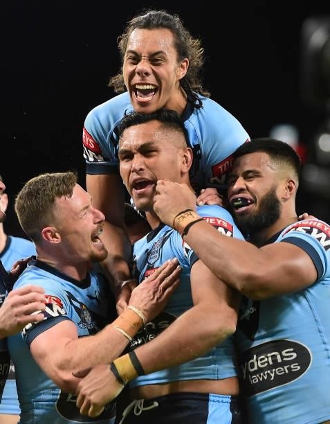 Daniel Saifiti of the Blues celebrates after scoring a try during game one of the 2021 State of Origin series between the New South Wales Blues and...
