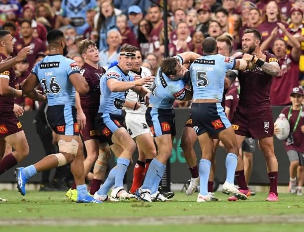 Players get in a melee during game one of the 2021 State of Origin series between the New South Wales Blues and the Queensland Maroons at Queensland...
