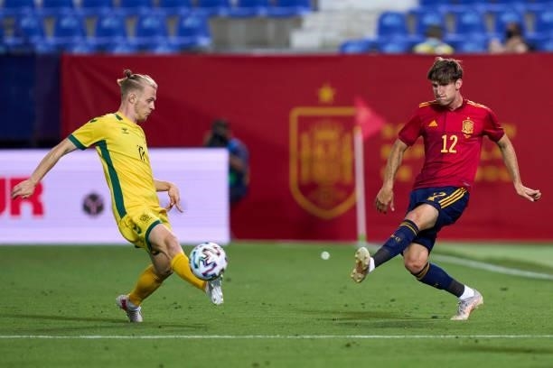 Juan Miranda of Spain U21 battle for the ball with Justas Lasickas of Lithuania during the international friendly match between Spain U21 and...