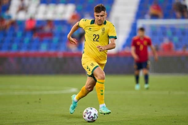 Fedor Chernykh of Lithuania runs with the ball during the international friendly match between Spain U21 and Lithuania at Estadio Municipal de...