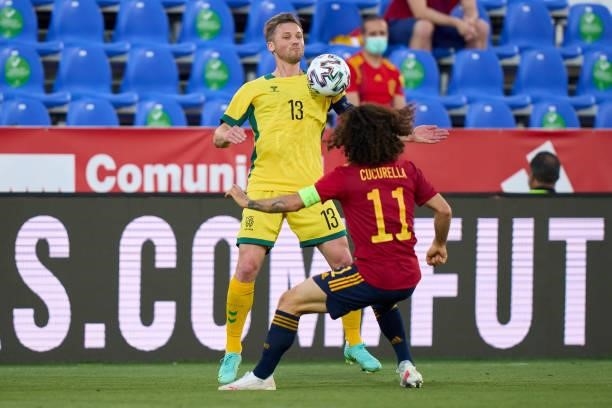 Marc Cucurella of Spain U21 battle for the ball with Saulius Mikoliunas of Lithuania during the international friendly match between Spain U21 and...