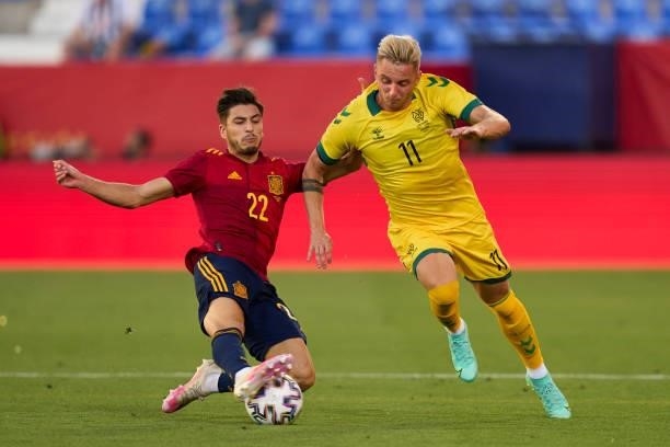 Oscar Gil of Spain U21 battle for the ball with Arvydas Novikovas of Lithuania during the international friendly match between Spain U21 and...