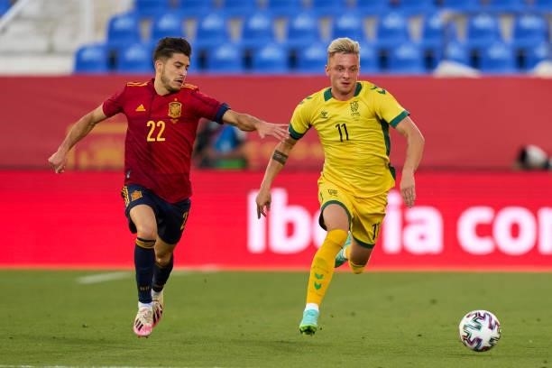 Oscar Gil of Spain U21 battle for the ball with Arvydas Novikovas of Lithuania during the international friendly match between Spain U21 and...