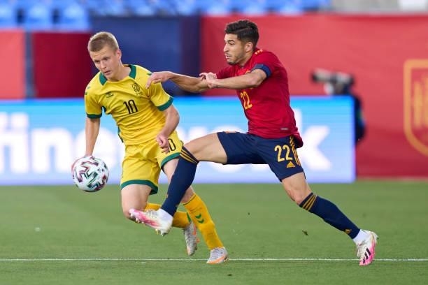 Oscar Gil of Spain U21 battle for the ball with Golubickas of Lithuania during the international friendly match between Spain U21 and Lithuania at...