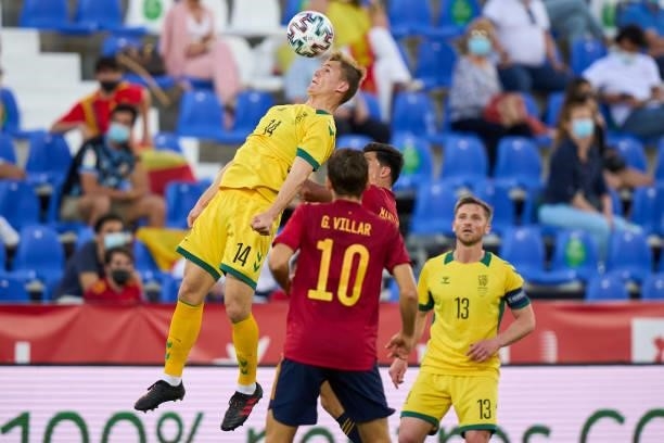 Martin Zubimendi of Spain U21 battle for the ball with Megelaitis of Lithuania during the international friendly match between Spain U21 and...