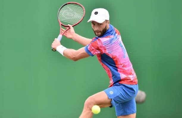 Liam Broady of Great Britain plays a backhand shot against Denis Kudla of United States in the Men’s Single on day five of the Viking Open at...
