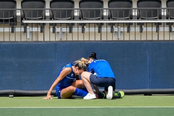 Ivanna Pessina of Italy receives medical treatment during the Euro Hockey Championships match between Germany and Italy at Wagener Stadion on June 9,...