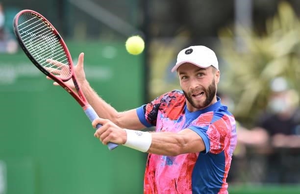 Liam Broady of Great Britain plays a backhand shot against Denis Kudla of United States in the Men’s Single on day five of the Viking Open at...