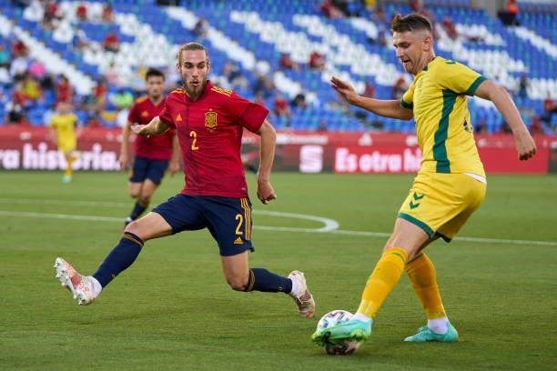 Oscar Mingueza of Spain U21 battle for the ball with Fedor Chernykh of Lithuania during the international friendly match between Spain U21 and...