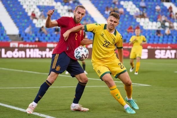 Oscar Mingueza of Spain U21 battle for the ball with Fedor Chernykh of Lithuania during the international friendly match between Spain U21 and...