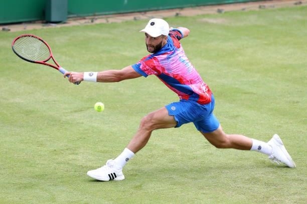 Liam Broady of Great Britain plays a forehand against Denis Kudla of United States during Day 5 of the Viking Nottingham Open at Nottingham Tennis...