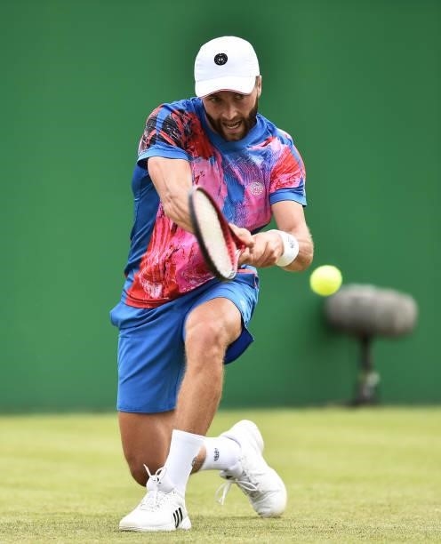 Liam Broady of Great Britain plays a backhand against Denis Kudla of United States in the Men’s Single on day five of the Viking Open at Nottingham...