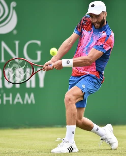 Liam Broady of Great Britain plays a backhand against Denis Kudla of United States in the Men’s Single on day five of the Viking Open at Nottingham...