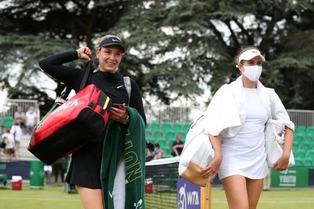 Johanna Konta of Great Britain and Donna Vekic of Croatia exit the court after victory against Sabrina Santamaria of United States and Lesley...