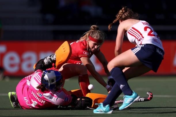 Abi Raye of Belgium battles for the ball with Goalkeeper, Maddie Hinch and Elizabeth Neal of England during the Euro Hockey Championships Women match...