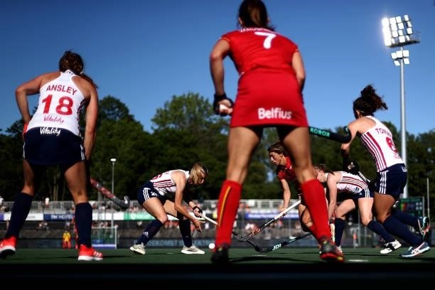 Barbara Nelen of Belgium battles for the ball with Lily Owsley and Isabelle Petter of England during the Euro Hockey Championships Women match...