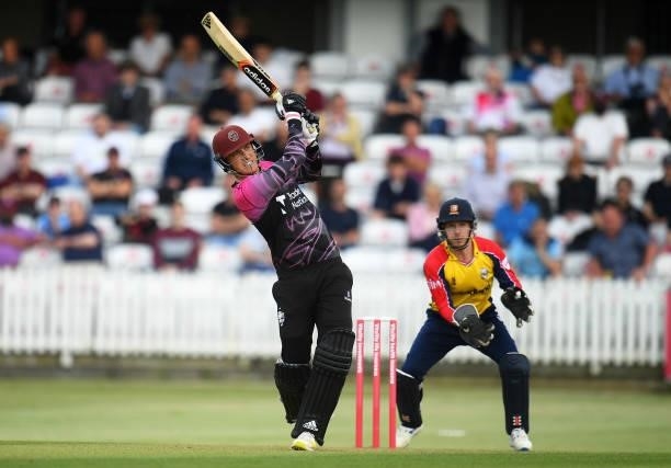 Tom Banton of Somerset plays a shot as Adam Wheater of Essex looks on during the Vitality T20 Blast match between Somerset and Essex at The Cooper...