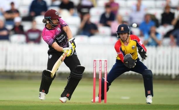 James Hildreth of Somerset plays a shot as Adam Wheater of Essex looks on during the Vitality T20 Blast match between Somerset and Essex at The...