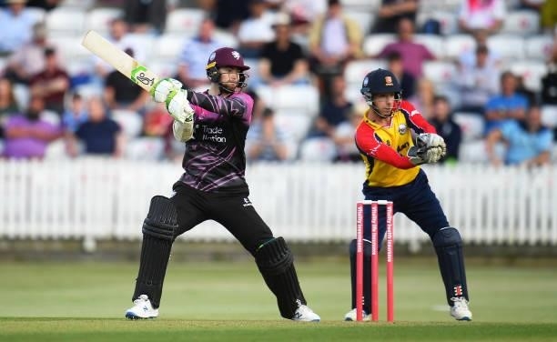 Eddie Byrom of Somerset plays a shot as Adam Wheater of Essex looks on during the Vitality T20 Blast match between Somerset and Essex at The Cooper...