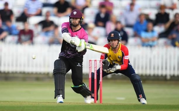 Eddie Byrom of Somerset plays a shot as Adam Wheater of Essex looks on during the Vitality T20 Blast match between Somerset and Essex at The Cooper...
