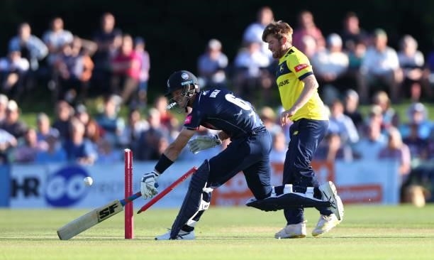 Liam Dawson of Hampshire Hawks attempts to run out Joe Denly of Kent during the Vitality T20 Blast match between Kent Spitfires and Hampshire Hawks...