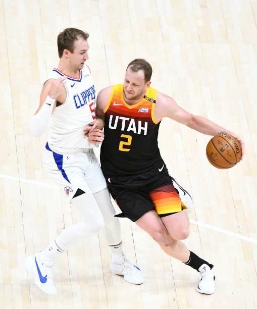 Joe Ingles of the Utah Jazz drives into Luke Kennard of the LA Clippers in Game One of the Western Conference second-round playoff series at Vivint...