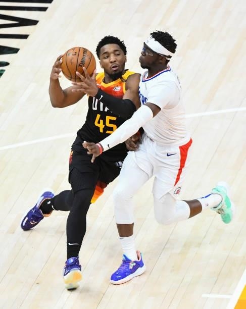 Reggie Jackson of the LA Clippers guards Donovan Mitchell of the Utah Jazz in Game One of the Western Conference second-round playoff series at...