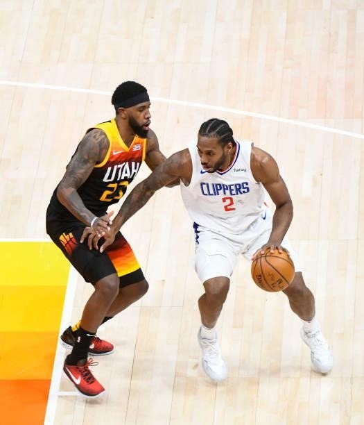 Kawhi Leonard of the LA Clippers drives into Royce O'Neale of the Utah Jazz in Game One of the Western Conference second-round playoff series at...
