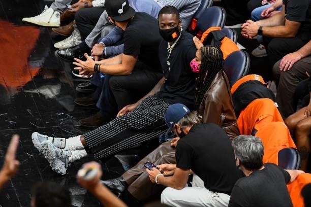 Utah Jazz owner Dwyane Wade sits with his wife Gabrielle Union during Game One of the Western Conference second-round playoff series against the LA...