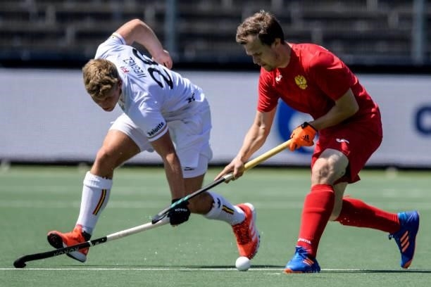 Victor Wegnez of Belgium and Pavel Golubev of Russia during the Euro Hockey Championships match between Belgium and Russia at Wagener Stadion on June...