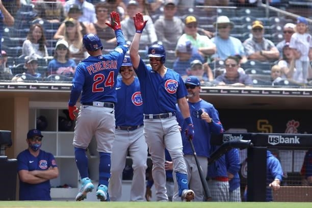Jason Heyward congratulates Joc Pederson of the Chicago Cubs after his solo homerun during the fourth inning of a game against the San Diego Padres...