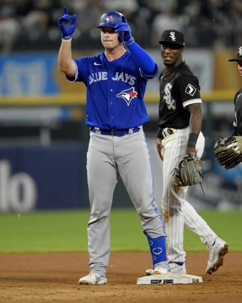 Riley Adams of the Toronto Blue Jays reacts after hitting a double for his first hit while making his Major League debut against the Chicago White...