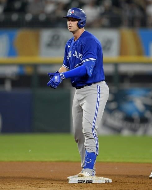 Riley Adams of the Toronto Blue Jays reacts after hitting a double for his first hit while making his Major League debut against the Chicago White...