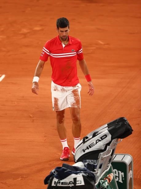Novak Djokovic of Serbia looks on afte taking a fall during his Mens Singles Quarter-Final match against Matteo Berrettini of Italy during Day Eleven...