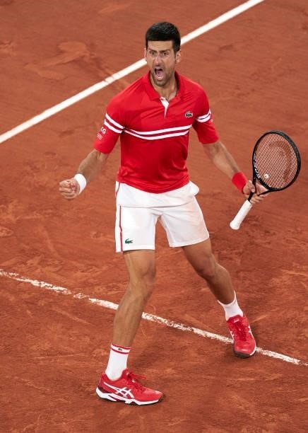 Novak Djokovic of Serbia celebrates after winning match point in his Quarter Final match against Matteo Berrettini of Italy during day eleven of the...