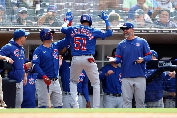 Sergio Alcantara of the Chicago Cubs is congratulated at the dugout after hitting a solo homerun during the eighth inning of a game against the San...
