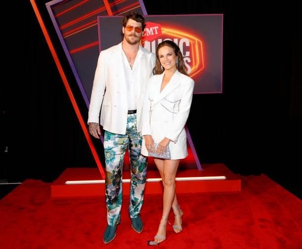 Taylor Lewan and Taylin Gallacher attend the 2021 CMT Music Awards at Bridgestone Arena on June 09, 2021 in Nashville, Tennessee.