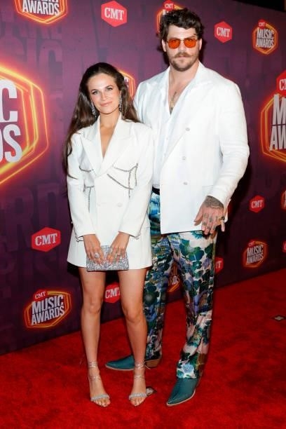Taylin Gallacher and Taylor Lewan attend the 2021 CMT Music Awards at Bridgestone Arena on June 09, 2021 in Nashville, Tennessee.