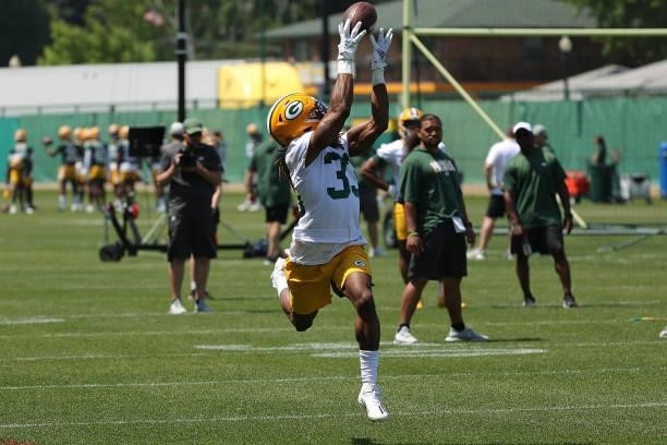 Aaron Jones of the Green Bay Packers works out during training camp at Ray Nitschke Field on June 09, 2021 in Ashwaubenon, Wisconsin.
