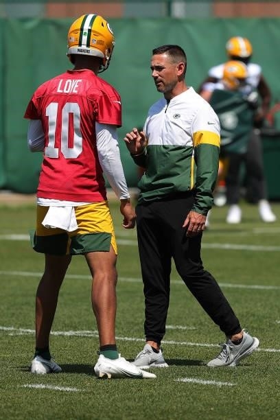 Head coach Matt LaFleur speaks with Jordan Love of the Green Bay Packers during training camp at Ray Nitschke Field on June 09, 2021 in Ashwaubenon,...