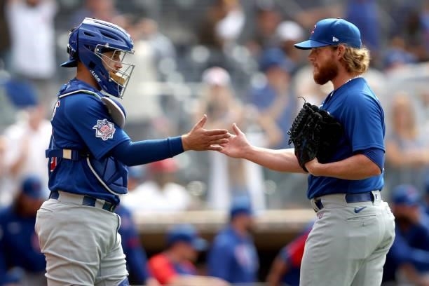 Higgins celebrates with Craig Kimbrel of the Chicago Cubs after defeating the San Diego Padres 3-1 in a game at PETCO Park on June 09, 2021 in San...