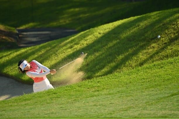 Yui Kawamoto of Japan hits her second shot out of a bunker on the 12th hole during the first round of the Ai Miyazato Suntory Ladies Open at Rokko...