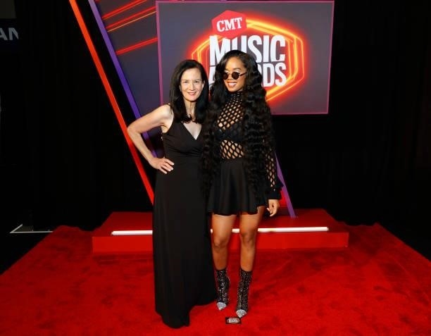 Leslie Fram and H.E.R. Attend the 2021 CMT Music Awards at Bridgestone Arena on June 09, 2021 in Nashville, Tennessee.