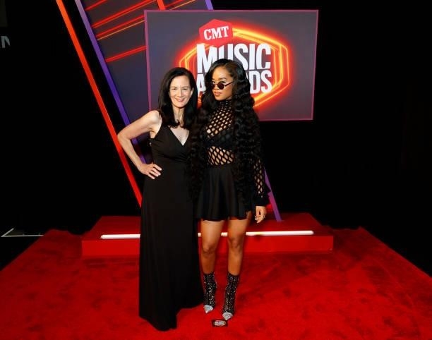 Leslie Fram and H.E.R. Attend the 2021 CMT Music Awards at Bridgestone Arena on June 09, 2021 in Nashville, Tennessee.
