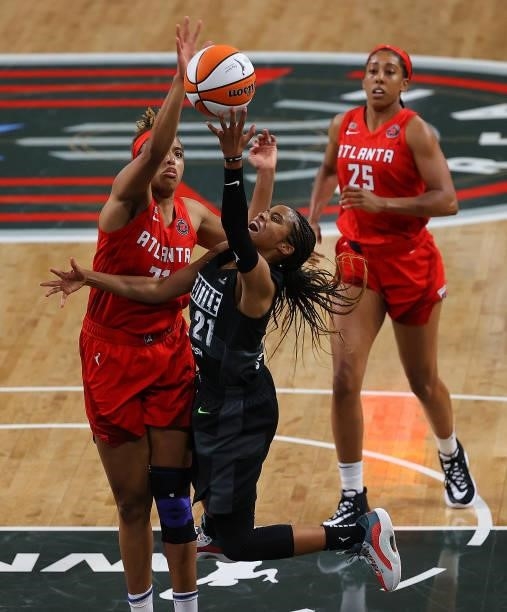Jordin Canada of the Seattle Storm drives against Tianna Hawkins of the Atlanta Dream in the second half at Gateway Center Arena on June 09, 2021 in...