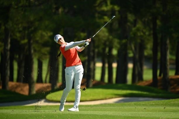 Asuka Kashiwabara of Japan hits her third shot on the 12th hole during the first round of the Ai Miyazato Suntory Ladies Open at Rokko Kokusai Golf...